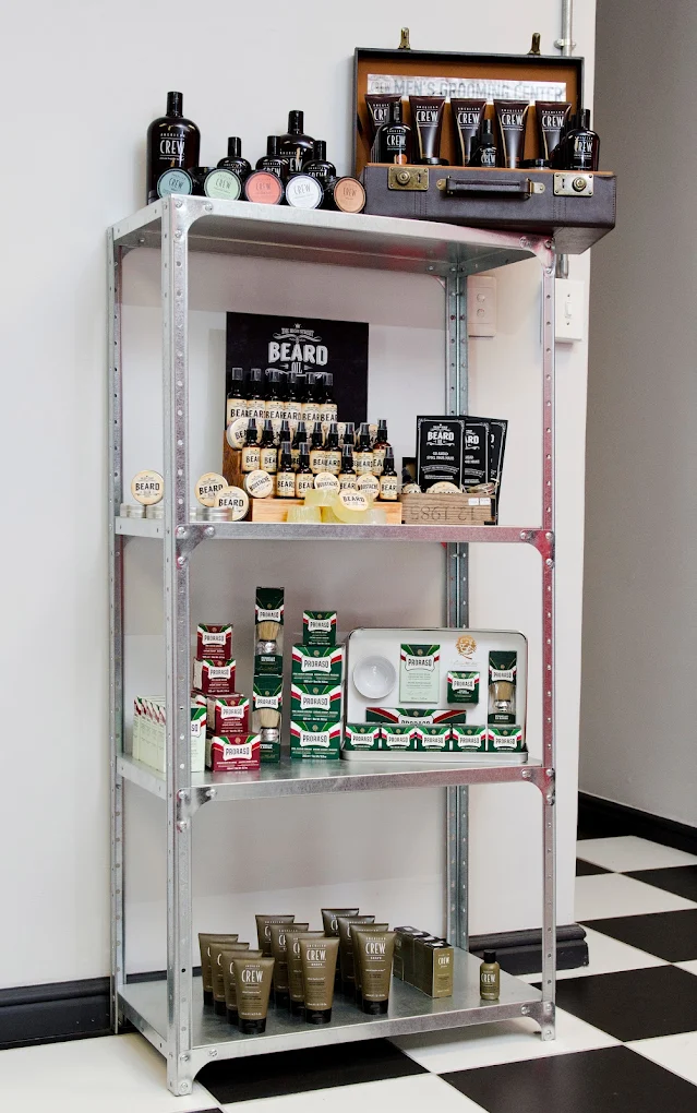 Retail shelf displaying American Crew and Proraso grooming products